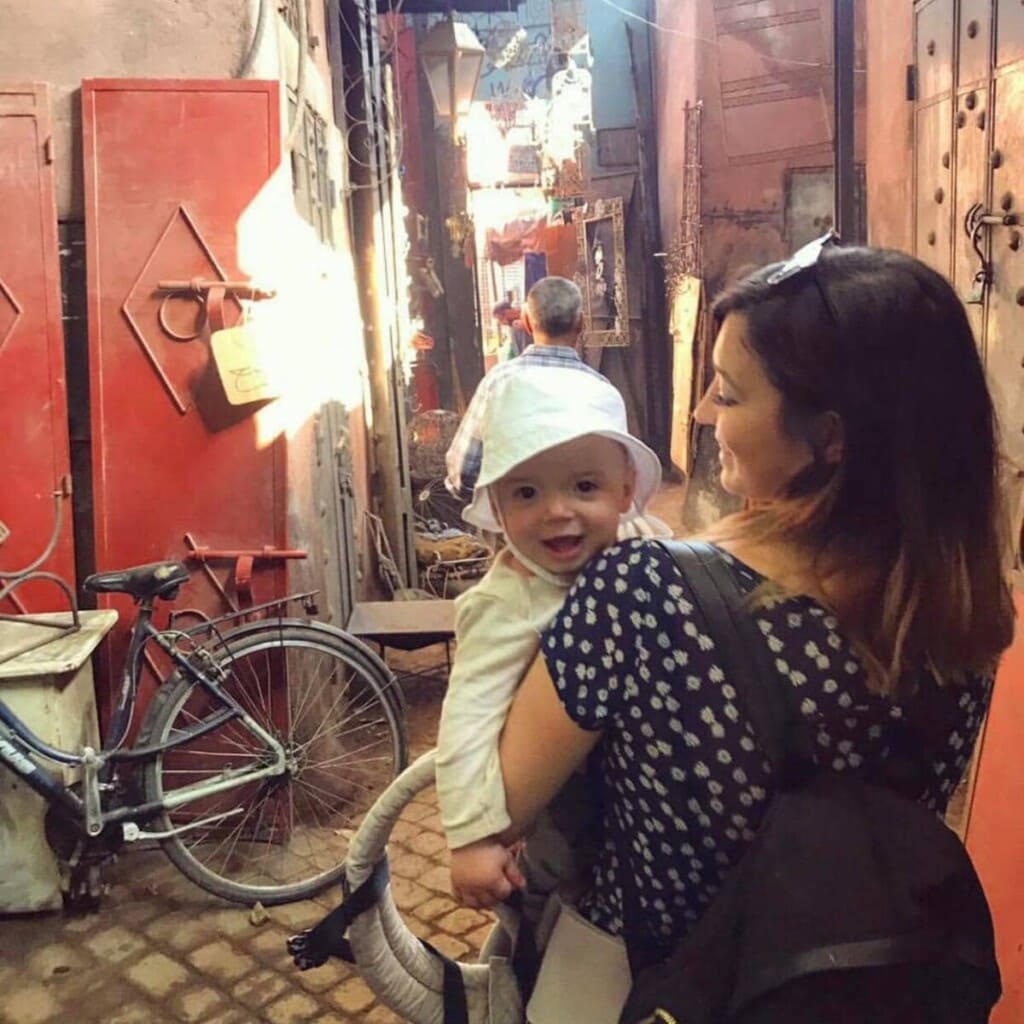Photo of Yasmin and her 1 year old son in Marrakech souks in 2019
