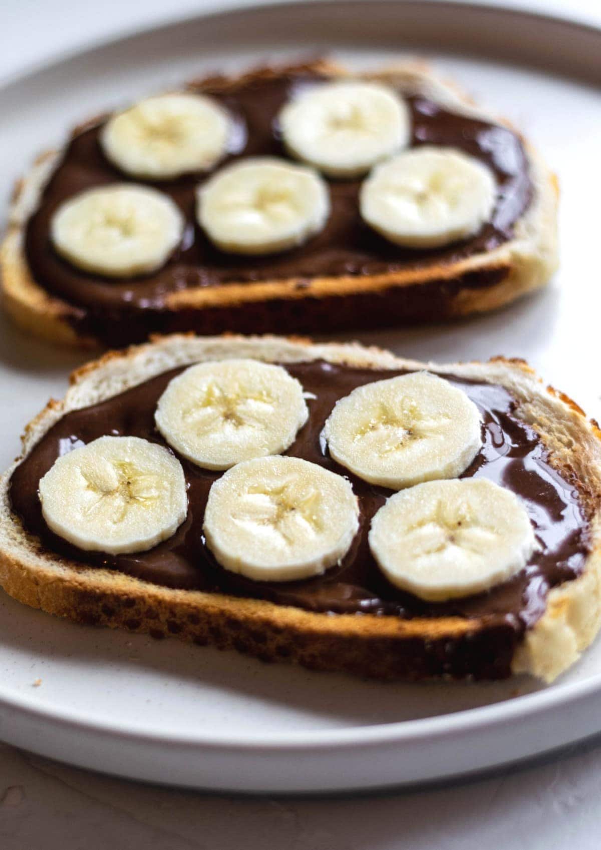Vegan nutella on toast with sliced banana.