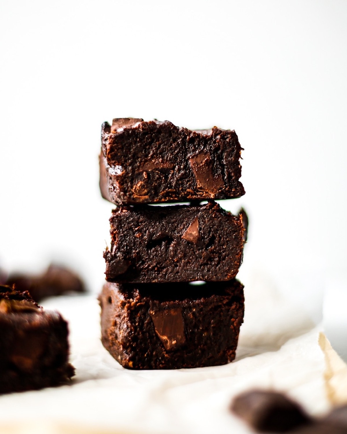 A pile of three of the vegan chocolate brownies.