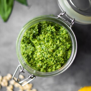 Overhead shot of a jar full of wild garlic pesto.