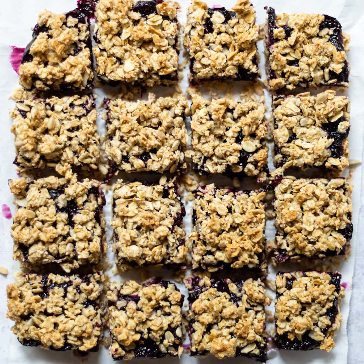 An overhead view of the whole batch of bars, on white parchment paper.